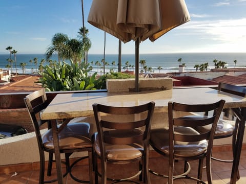 nice balcony seating for 4 with umbrella