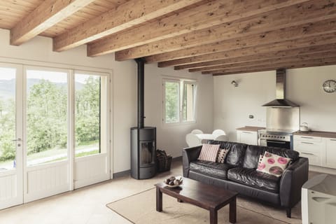 Open plan living zone in the barn - kitchen, dining and living - plus fab views!
