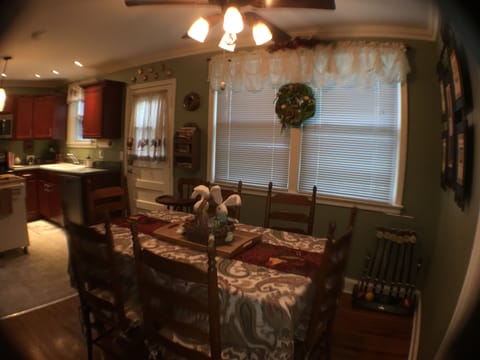 Dining and kitchen area. Back door leads to brick patio & yard. Easter decorated