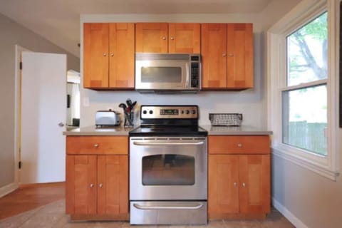 It includes a gas stove, microwave, fridge, coffee maker, etc.