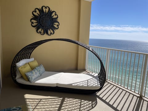 Lounge luxuriously on this 2-person daybed on your gulf-front balcony 