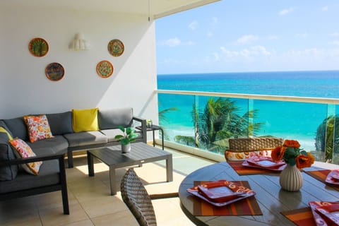 Oceanfront balcony, offering panoramic views of the turquoise Caribbean waters.