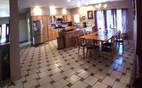 Kitchen and dining room. Table seats 12 + with room for a folding table, too.