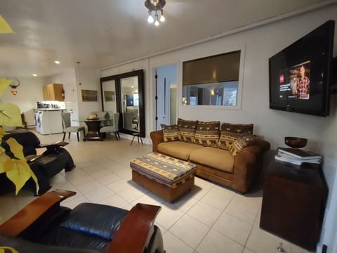 Living room with large screen TV and fireplace