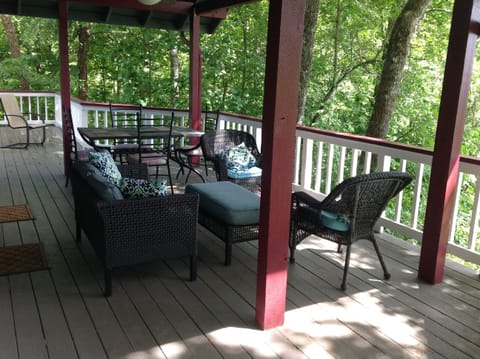 Our covered porch with room for eating and/or relaxing