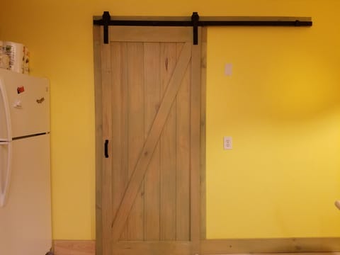 Sliding barn door to the second bedroom.