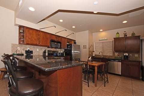 Kitchen with  Granite Counter tops and 3 Counter Bar Stools