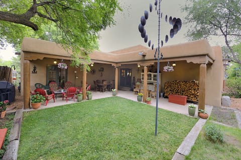 Front Yard with outdoor seating, dining and Barbi., lots of wood, Wind feature. 