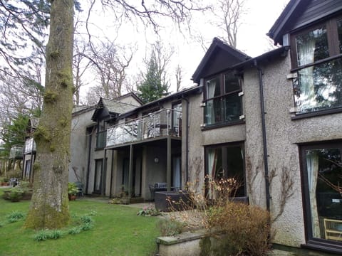 The flat is upstairs with a balcony overlooking the grounds at the rear.