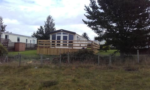 The actual site and full view of chalet taken from field.