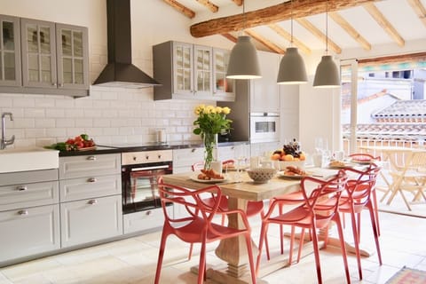 Spacious and sunny kitchen with direct access to large terrace.