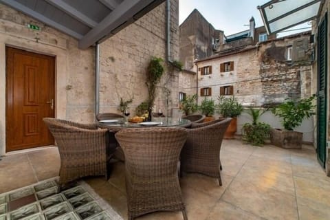 Terrace featuring newer table and chairs