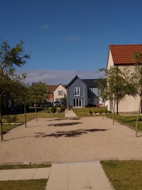 Rear of the cottage from the boules pitch, showing Beach Haven Cottage near RHS.