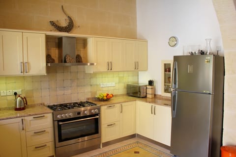 The fully equipped kitchen in our home.