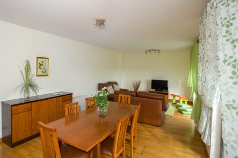 Spacious, bright dining and living room with flat-screen TV and Wi-Fi.