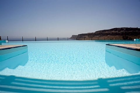 Pool view from living area and out door dining