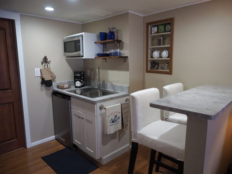 Kitchenette has a microwave & mini fridge. Is complete w/ dishes, flatware, etc.