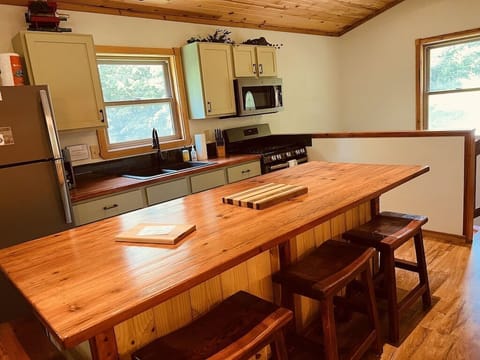 Kitchen with beautiful reclaimed wood counter tops and large island