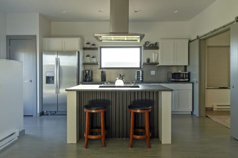 Open kitchen with all the necessities for a cup of coffee or cooking up a meal.