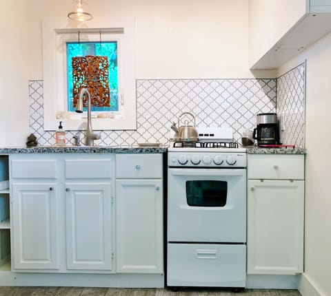 Kitchen has gas range, coffee maker, microwave and full size refrigerator
