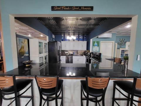 Black stainless steel appliances & black granite counter tops and flooring