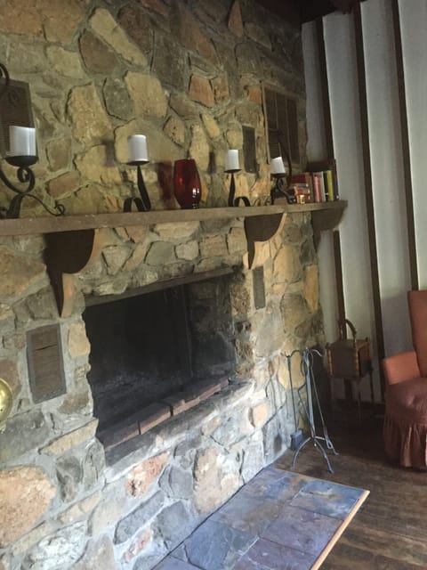 full wall stone fireplace to relax in front of, books for quiet moments