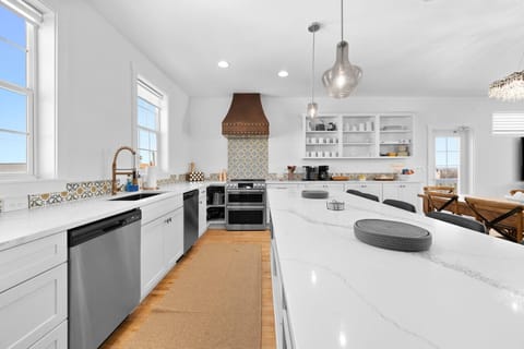 Kitchen full of pots, pans, utensils, dishware, coffee, and on and on