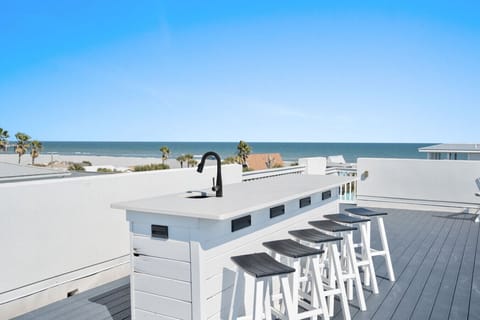 Sink, refrigerator, and bar - Ocean in the background
