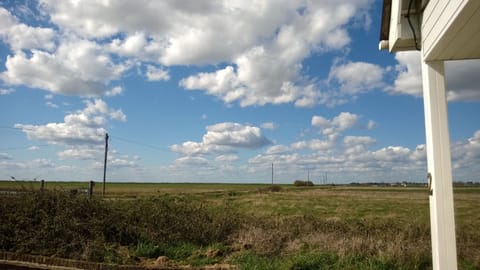 Beautiful endless skies looking to right from bench under kitchen window