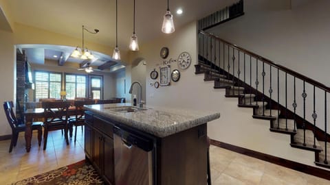 Fully stocked gourmet kitchen featuring granite countertops