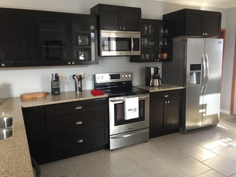 Fully equipped kitchen with brand new stainless appliances and a dishwasher
