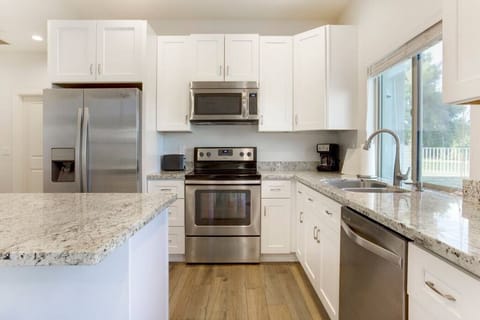 Full kitchen with stove, oven, fridge, dishwasher, microwave, coffee maker