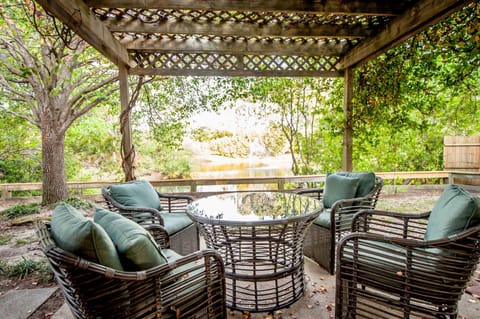 The patio facing the private pond brings ultimate relaxation