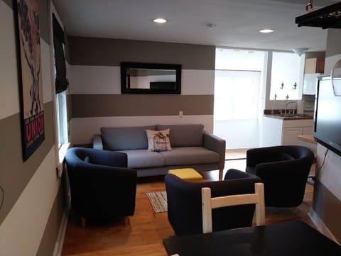 Living area features a smart tv with Roku