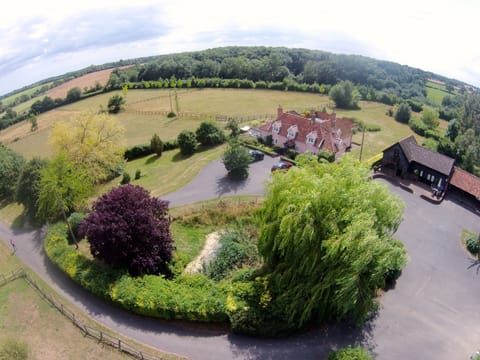 Paddock Barn in ground floor of black barn, surrounded by countryside. 