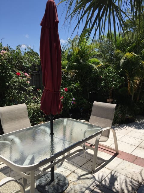 Outdoor seating with a grill.