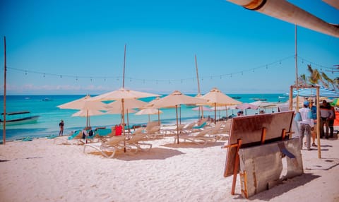 On the beach, sun loungers, beach umbrellas, beach towels