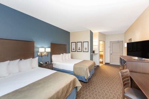 Desk, blackout drapes, iron/ironing board, free cribs/infant beds