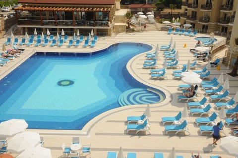Seasonal outdoor pool, open 10:00 AM to 6:00 PM, pool umbrellas