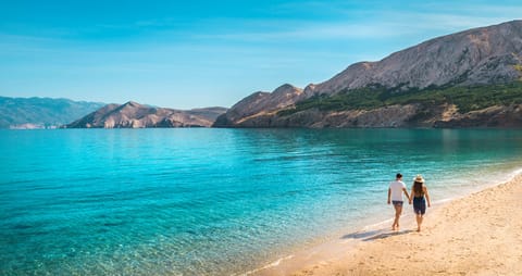 On the beach, sun loungers, beach umbrellas, beach towels