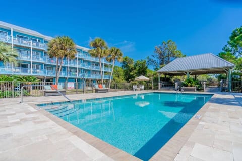 Pool with the condo in the background.