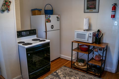 Refrigerator w freezer. Gas Stove top with Oven. Microwave.