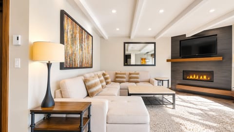 Cozy Modern Living Area with Natural Light and Mountain Views