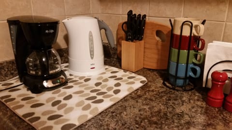 Complimentary tea & coffee supplies, dishes, pots & pans needed to cook a meal.