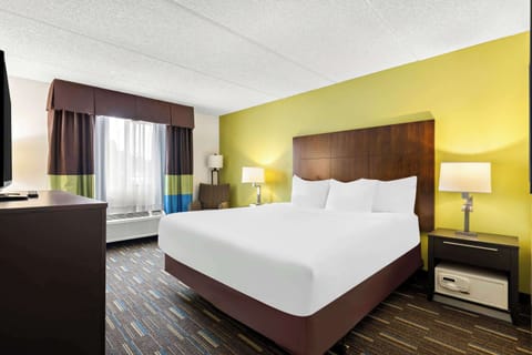 Desk, laptop workspace, blackout drapes, iron/ironing board