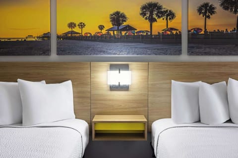 Desk, laptop workspace, iron/ironing board, free cribs/infant beds