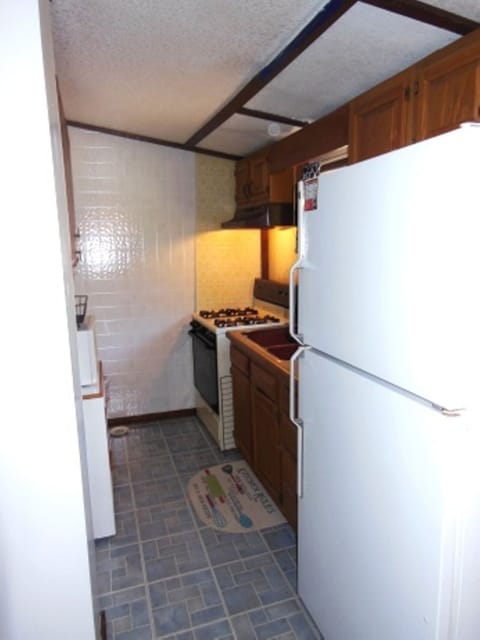 Kitchen has everything you need for daily living, with microwave and coffee pot.