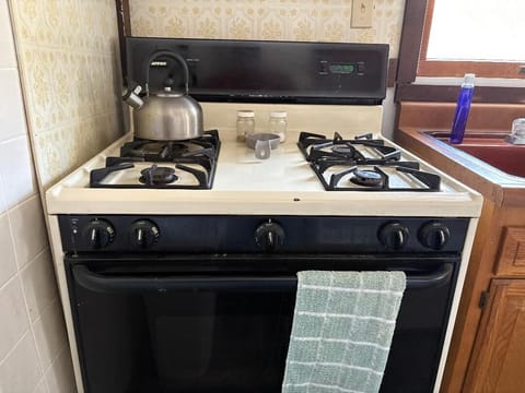 Full-sized stove with oven and broiler.