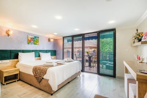 Family Triple Room | Premium bedding, minibar, in-room safe, individually decorated