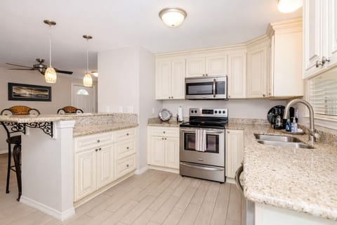 Full kitchen with stainless steel appliances 